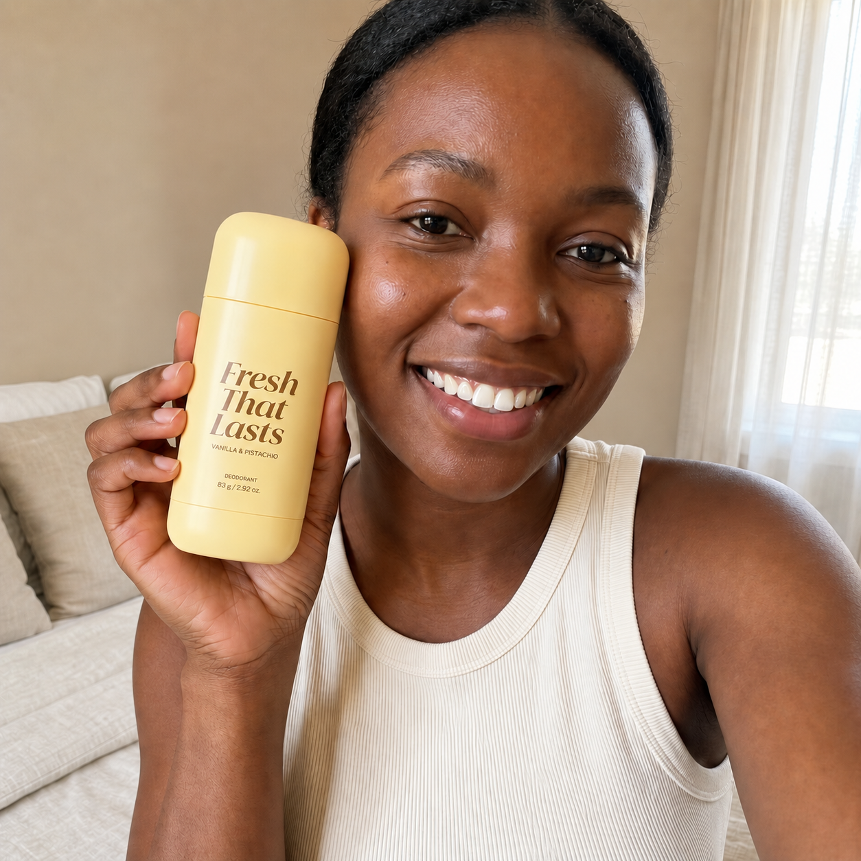 Customer testimonial holding Fresh That Lasts deodorant at home